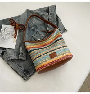 Stylish contrast color woven bucket shoulder bag for women, casual daily accessory with strap.