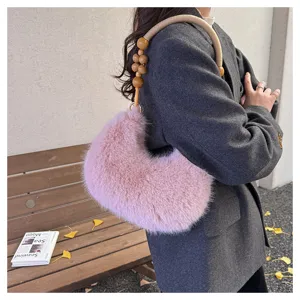 Fluffy plush shoulder bag with wooden bead handle, cute pink winter handbag for women.