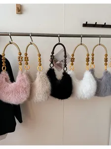 Furry plush handbag with wooden bead handle, cozy winter shoulder bag in multiple colors.