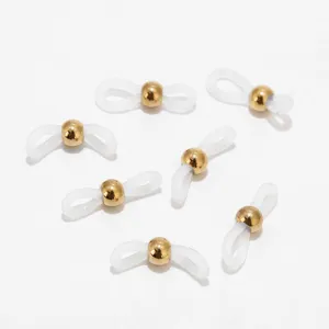 Detailed view of clear silicone eyeglass chain connectors with golden metal beads for eyewear.