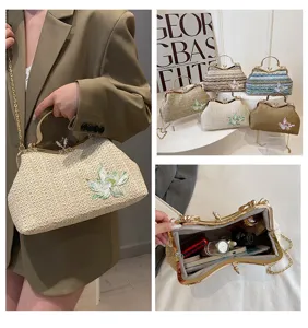 Straw woven handbag for women stylish kiss-lock shoulder bag with floral embroidery.