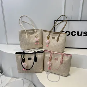 Large capacity straw tote bag, stylish contrast color shoulder bag with fluffy keychain for commute.