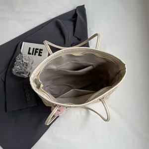 Commuter large capacity straw woven tote bag for women, stylish summer shoulder bag with lining.