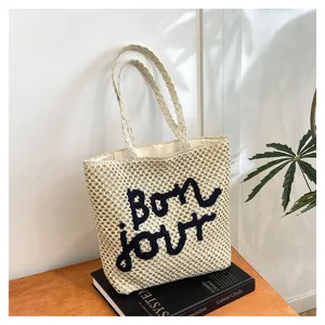 Straw woven tote bag with chic letter embroidery, casual shoulder bag for beach and vacation.
