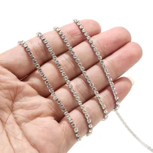 Close-up view of 2.5mm rhinestone claw chain, sparkling silver DIY jewelry making accessory.
