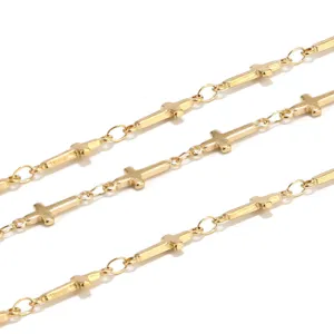 Close-up detail of golden cross chain links, perfect for DIY jewelry making and bracelets.