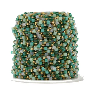 Detailed view of green cube bead chain roll, stainless steel jewelry making DIY supply.