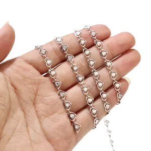 Detail view of stainless steel hollow heart link chain, perfect for DIY jewelry making.
