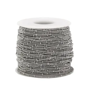 Close-up of stainless steel beaded chain on roll, perfect for handmade DIY jewelry making.
