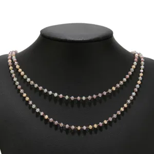 Close-up detail view of double layered multi-color beaded necklace with crystal beads.