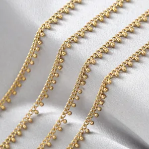 Gold beaded chain detail shot, stainless steel curb link with small balls for DIY crafts.