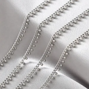 Detailed shot of silver titanium steel bead chains, perfect for DIY jewelry and bag making.