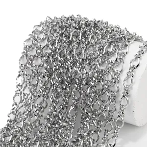 Close-up detail shot of shiny stainless steel twisted chain for DIY handmade jewelry crafting.