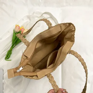 Woven straw tote bag for women, casual summer beach handbag with zipper closure and interior pockets.