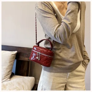 Burgundy quilted mini chain shoulder bag detail, stylish crossbody bag for women.