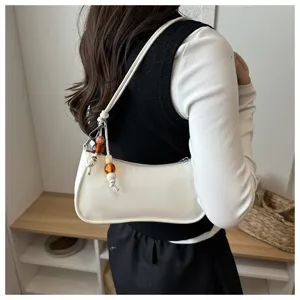 Minimalist white PU shoulder underarm bag with beaded charm for women stylish daily commuting design