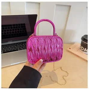 Mini pink pleated shoulder bag with handle and stylish chain strap for women chic style.