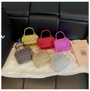 Metallic ruched mini top handle crossbody bag with chain strap for women fashion details.