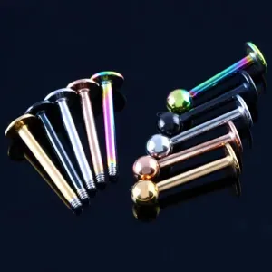 Detailed view of stainless steel multi-color piercing jewelry labret studs, smooth finish.