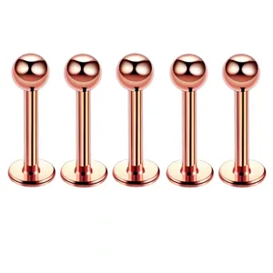 Stainless steel rose gold labret stud piercing detail view, smooth polished spherical body jewelry.
