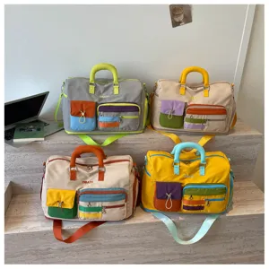 Large capacity color-block travel duffel bag with multi-pockets, ideal for weekend trips.