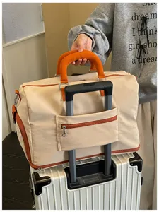 Color-blocked large capacity travel duffel bag, versatile commuter storage bag for weekend trips.