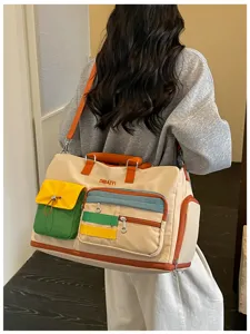 Colorblock dopamine travel duffel bag with multiple pockets for women short trips.