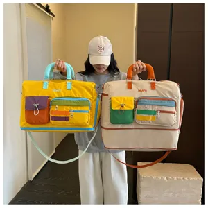 Color-blocking dopamine travel bag, large capacity short trip weekender with multiple pockets.