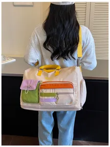 Colorblock large travel duffel bag for women, multi-pocket casual commuter shoulder luggage.