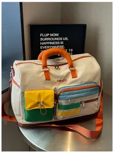 Color-block dopamine travel duffle bag with large capacity, multi-pocket design for trips.
