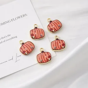 Cute enamel pumpkin charms for DIY jewelry making, sweet autumn accessories for necklaces and bracelets.
