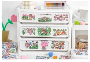 Detailed close-up view of cute cartoon decorative washi tape stickers for journal DIY.