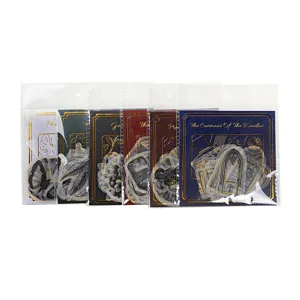 Retro gold-stamped sticker packs, dark botanical journal DIY craft decorative supplies.
