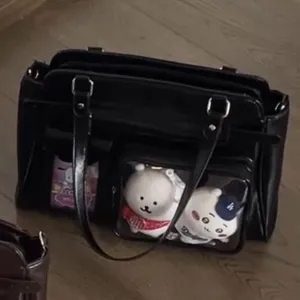 Black PU leather ita bag with transparent front pocket for cute dolls, crossbody shoulder bag.