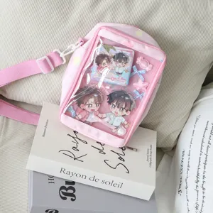 Japanese style mini pink ita bag with clear window, cute crossbody bag for anime merchandise pins.