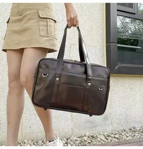 Detail view of large PU JK uniform bag, classic Japanese school style student handbag.