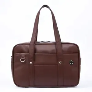 Detail view showing the dark brown PU leather Japanese style JK school bag front hardware parts.
