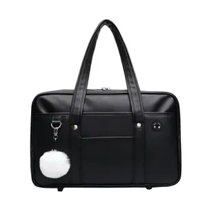 Detailed close-up view of black PU leather Japanese JK school uniform handbag with cute plush ball.