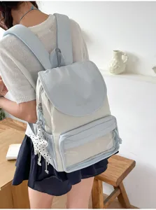 Detailed view of lightweight commuter backpack with transparent front pocket and cute star charm.