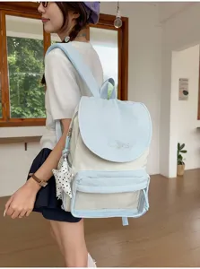 Detail view of a chic lightweight casual backpack in light blue and white, stylish and practical.