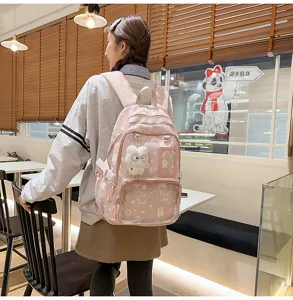 Cute pink star print school backpack for teens, large capacity multi-compartment daypack bag.