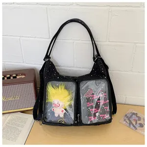 Black star print ita bag detail showing double clear front pockets and cute doll display space.