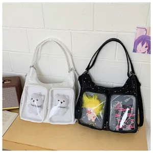 Clear window ita canvas shoulder bag with dual transparent plush doll display pockets for daily use.