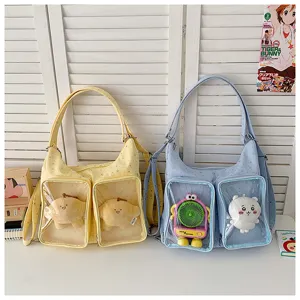 Details of the cute ita shoulder bag with clear front pockets for pins and plush doll displays.