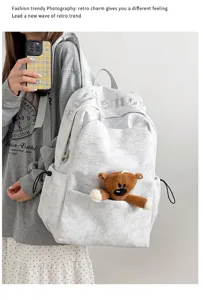 Mochila de lona ligera de gran capacidad estilo coreano con lindo colgante de oso de peluche.