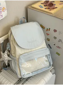 Details of the lightweight dual-color casual backpack with clear front pocket and cute charms.