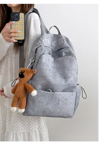 Mochila de lona gris para mujer, bolsa escolar de gran capacidad con colgante de oso para viaje.