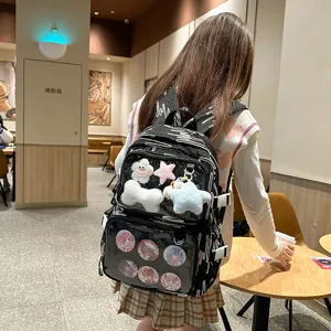 Detailed view of Japanese anime ita backpack with clear front pocket for pins and plush toys.