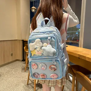 Detailed view of anime ita backpack with transparent front pocket and cute plush charms.