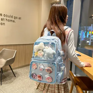 Detailed view of a light blue anime ita backpack with transparent front pockets and cute badges.